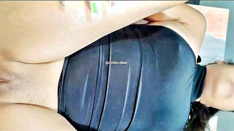 Amateur Asian woman exposes hairy pussy in black dress, legs spread