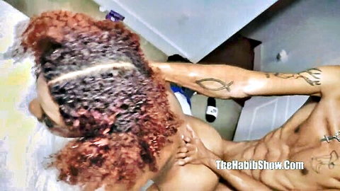 Tattooed muscular black stud fucks thick ebony babe's big juicy ass doggy style