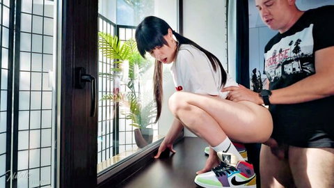 Asian hottie squats bottomless by window as white guy grabs her ass with hard cock out
