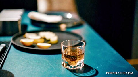 Elegant whiskey glass with snacks on blue bar table, Dorcel Club