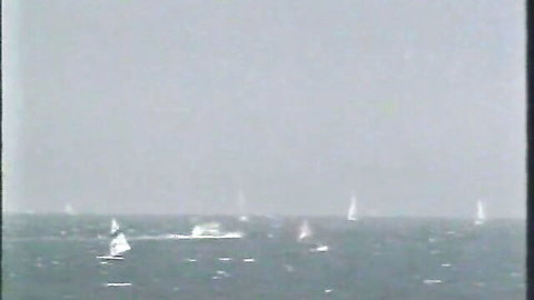 Vintage black and white sailboats sailing on foggy ocean sea