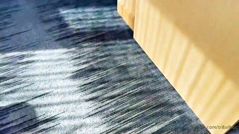 Shadowy blue textured floor with yellow stripes and tribimaxx.com watermark