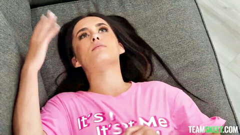 Daisy Pheonix lounging in pink 'It's All For Me' t-shirt, teasing gaze