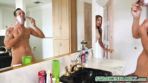 Naked muscular DILF shaves in bathroom mirror as young Asian stepdaughter peeks in doorway