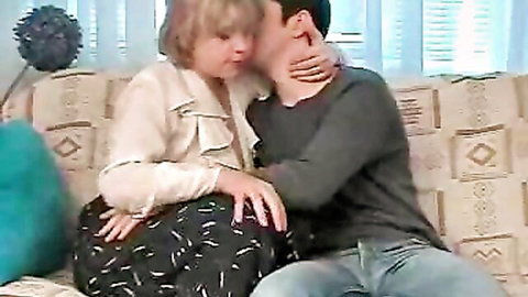 Chubby mature blonde wife kissed intimately by husband on couch