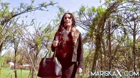 Hot cougar MariskaX walks seductively outdoors in fur-trimmed jacket