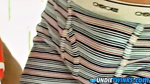 Twink's massive cock bulge strains striped underwear