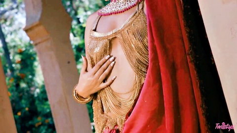 Curvy South Asian beauty in gold chainmail bikini top teasing massive underboob and tits outdoors