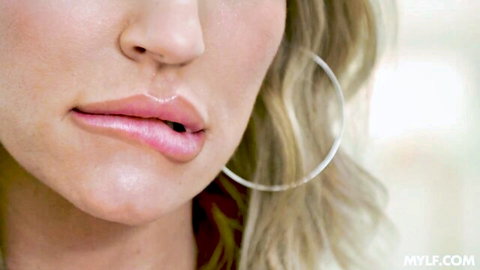Rachael Cavalli's seductive glossy lips and blonde curls in close-up