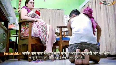 Desi Indian housewife in saree with kneeling servant boy in intimate scene