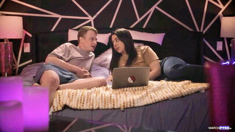 Brunette stepsister and young stepbrother watch laptop together on bed in taboo tease