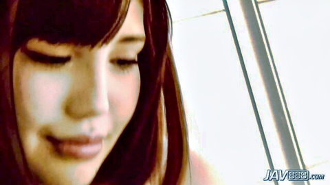 Close-up of cute Japanese brunette girl with bangs eyes closed smiling seductively
