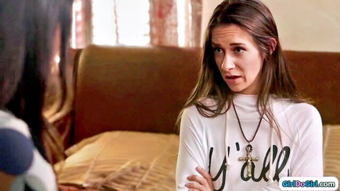 Brunette MILF in tight white Y'ALL sweater looks surprised at stepdaughter on bed