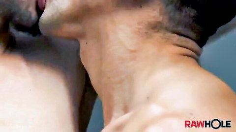 Tattooed muscular gay studs passionately kissing necks shirtless