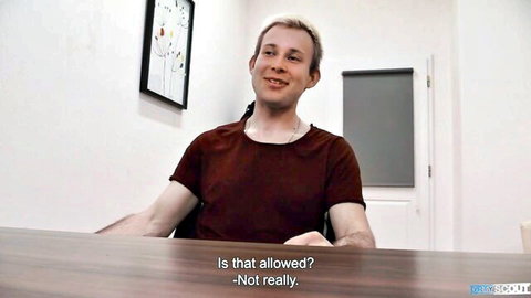 Shy blonde introverted dude smiling in maroon t-shirt, gay adult scene