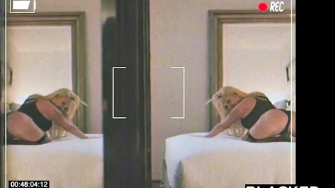 Blonde babe in skimpy black bodysuit teases her average ass doggy style on bed with mirror reflection
