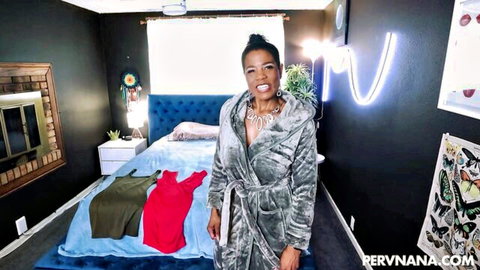 Curvy ebony MILF with big tits teases in open silk robe smiling in bedroom