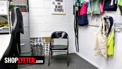 Empty black folding chair in cluttered ShopLYTER shop fitting room with hanging clothes and bags