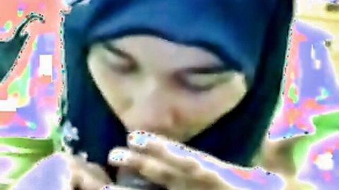 POV closeup of hijab-wearing Arab woman giving intense blowjob