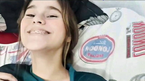 Shy stepsister with braces smiles in green top, big tits implied