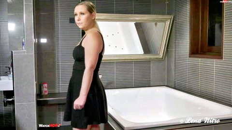 Blonde MILF Lena Nitro in tight black dress, teasing POV bathroom scene