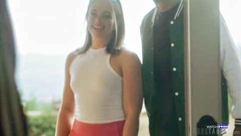 Sophia Burns smiling in white tank top and red skirt with BBC hunk outdoors