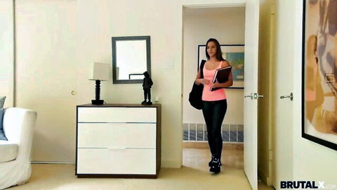 Amirah Adara enters room in tight pink top and black leggings, curvy figure