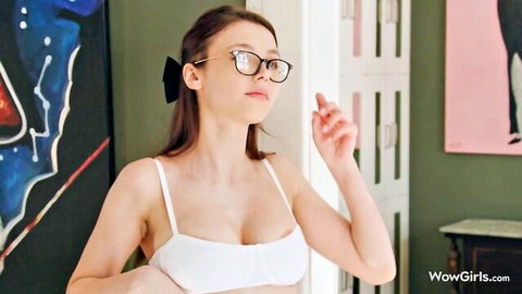 Mila Azul teases in white lingerie and glasses, showing massive cleavage