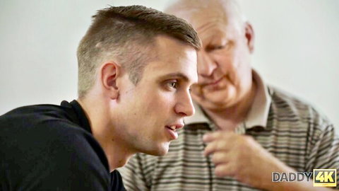 Bald older daddy whispers intimately to fit young twink in black shirt, Daddy4K