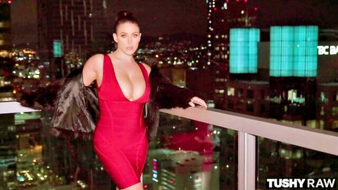 Curvy brunette with huge tits in tight red dress flaunting cleavage on city balcony
