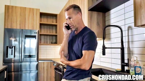 Muscular DILF stepdad on phone in modern kitchen before taboo fuck