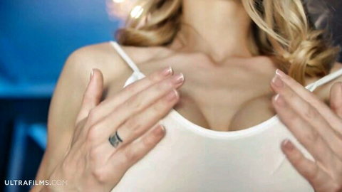 Blonde babe cupping her perky tits in thin white top with hard nipples visible