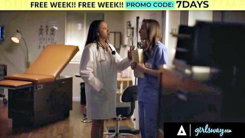 Ebony doctor in lab coat and blonde nurse in scrubs chatting in medical exam room