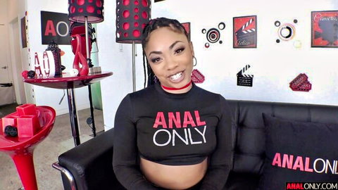 Cali Caliente smiling in sexy black Anal Only crop top, teasing her curves