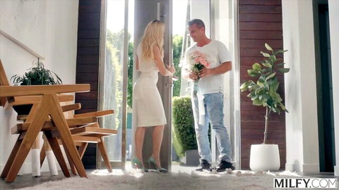 Brandi Love in white dress greets Manuel Ferrara with flowers, blonde MILF seduction