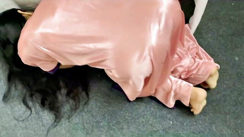 Asian step-aunt in pink satin dress posed doggystyle on floor