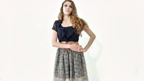 Blair Summers in sexy black lace top and patterned skirt, curly red hair, seductive pose