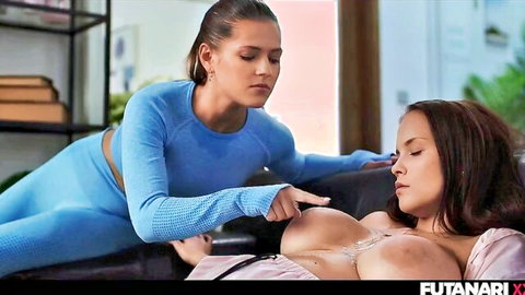 Futanari chick in blue leggings fondles big tits of lying partner