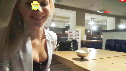 KatiesClub blonde bombshell in open blazer showing deep cleavage at eatery