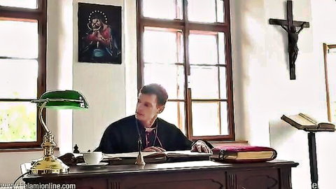 Zac Dehaan as sexy priest in clerical collar at desk, gay fantasy vibe