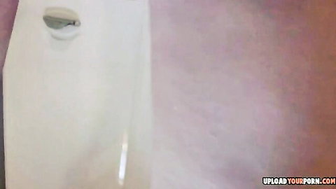 Panty-free upskirt view of a sexy blonde woman exposing shaved pussy