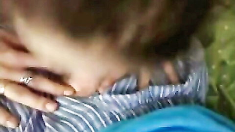 Brunette giving deep POV blowjob, hands with rings gripping man's striped thighs