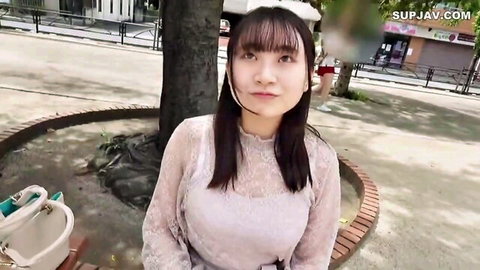 Stunning Asian babe with massive tits in seductive white lace dress outdoors