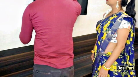Desi Indian wife in blue saree standing seductively with husband from behind