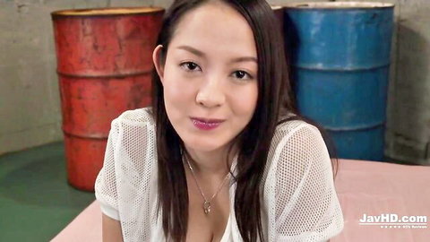 Slim Japanese beauty with medium tits visible through sheer white top smiles in POV.