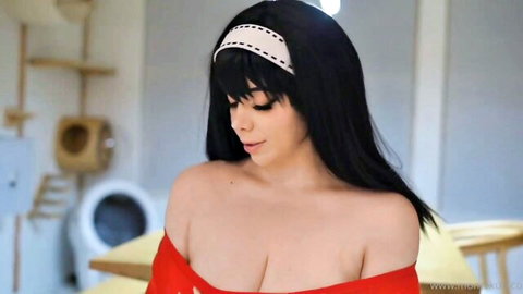 Seductive brunette with massive tits spilling from red off-shoulder top, teasing deep cleavage