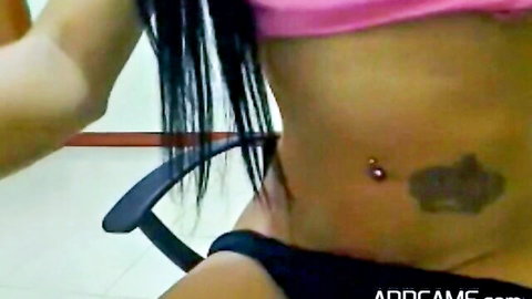 18-year-old Asian shemale teases in pink top and black panties with navel piercing