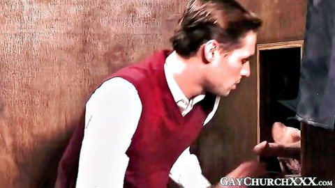 Handsome man in red vest peers closely at thick cock sticking out of glory hole