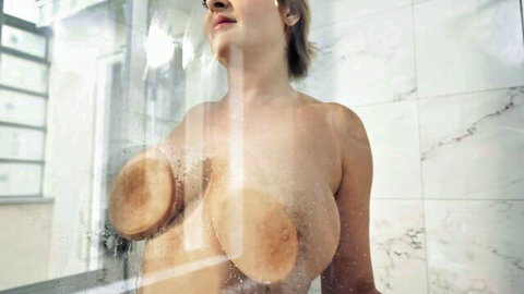 Blonde curvy babe pressing huge natural tits against foggy shower glass, nude body steaming