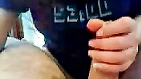 Girlfriend with red nails grips thick veiny cock on ebony shirt closeup